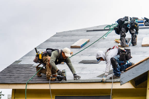 Professional Roofing technician working in Montebello, NY